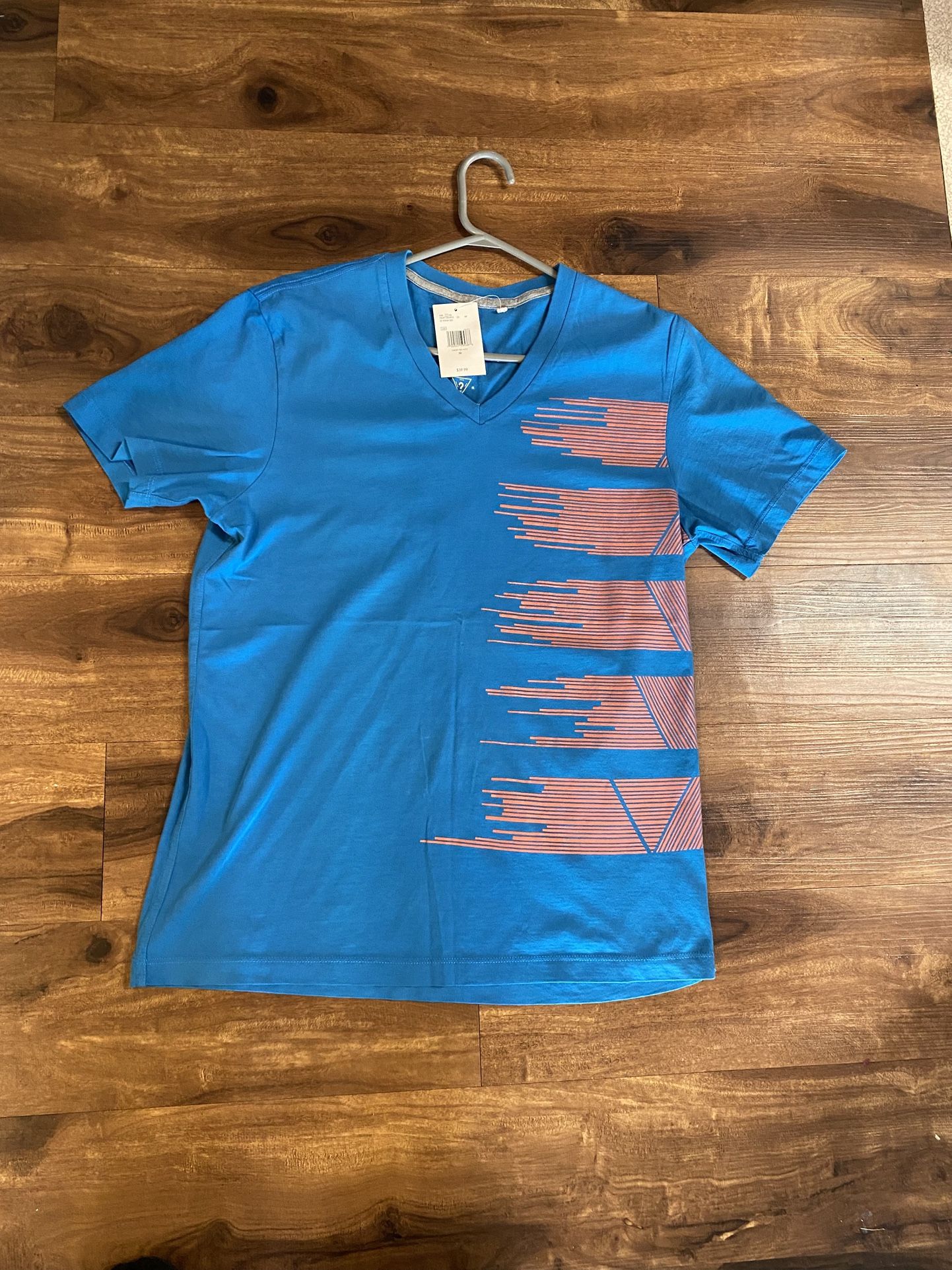 Brand new Mens Guess brand blue V Neck shirt up for sale