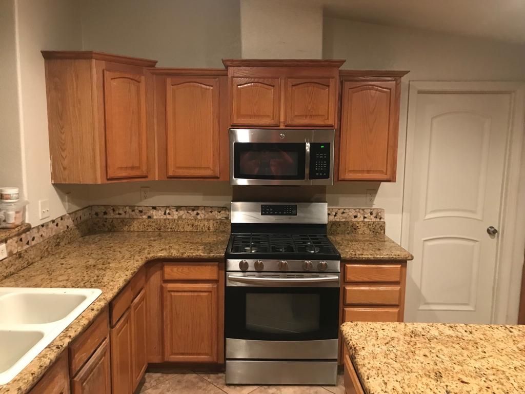 Complete kitchen for sale, counter top with island, kitchen cabinets kenmore stove and microwave kenmore all