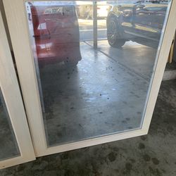 *** TWO ENCASED MIRRORS