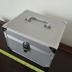 small, silver-colored aluminum alloy storage case