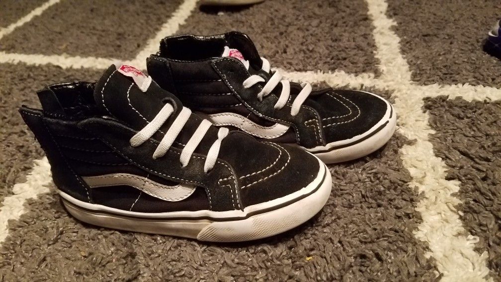 Black and white high top Vans