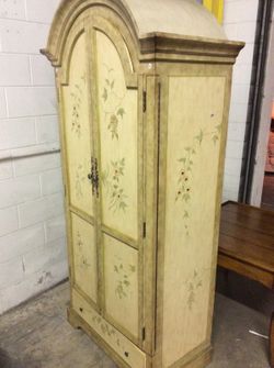 French decoratively designed armoire dresser with curved top shelving and bottom drawer