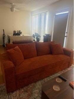 79.5” L x 32” W Orange Couch. Basically New.