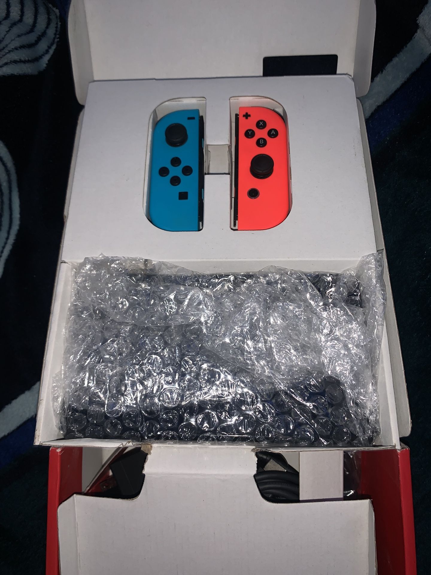 Nintendo Switch With Neon Blue And Neon Red 