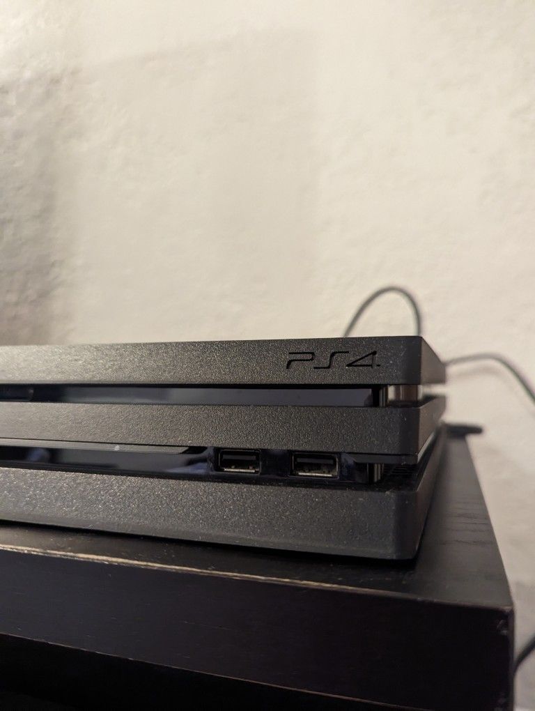 PS4 Pro 1TB In Original Packaging Games Bundle $290