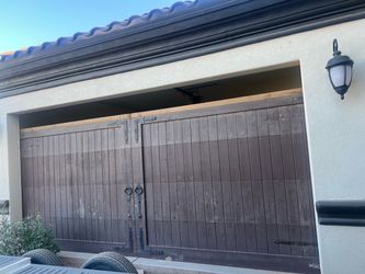 Real wood garage doors 2 available $750 each including all hardware