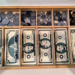 Melissa and Doug play money in a wooden money box. Good condition 