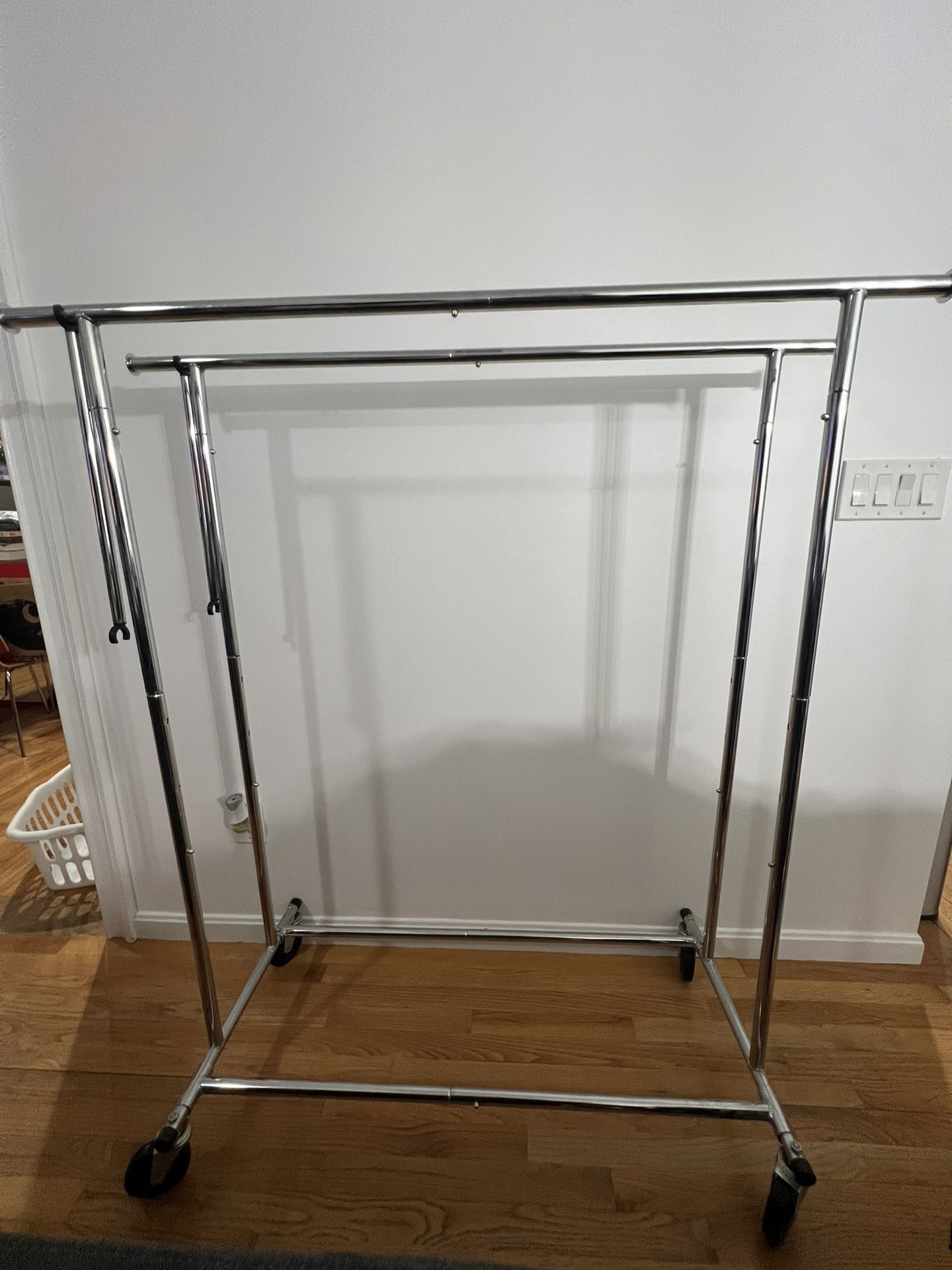 Double Clothes Hanging Rack With Extendable Ends .