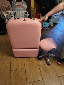 Pink massage table and rolling stool