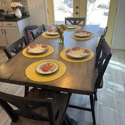 Dining room table with chairs and matching entertainment stand