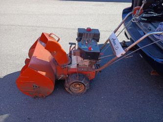 Vintage ariens snow blower.