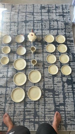 Noritake set with bowls, plates, cup, and teapot.