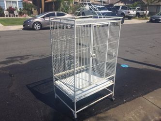 !WHITE METAL BIG BIRD CAGE !!Has wheels at the bottom for transportation.