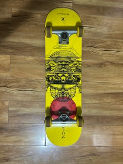 Brand: Rodriguez , Color: yellow deck with black artwork and a red circular accent and yellow wheels