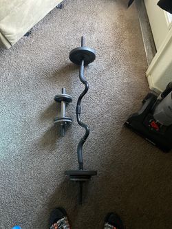 Weights 40 pounds curl bar and 1 adjustable dumbbell
