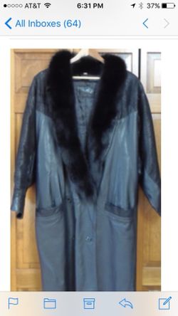 Women’s genuine leather coat with genuine fur collar. Like new from Saks 5th Ave. sleeves have a delicate pattern to them. Size medium
