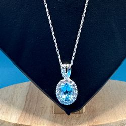 New Oval 2.66 Carat Blue Topaz 17” Long & Weighs 2.80 Grams Halo Setting With White Topaz Round Gems All Are Prong Set Pristine!