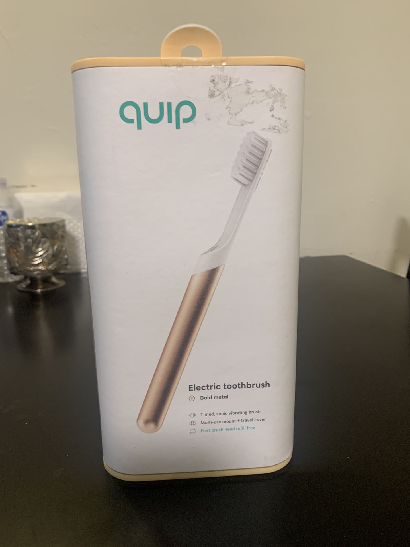Gold quip electric toothbrush