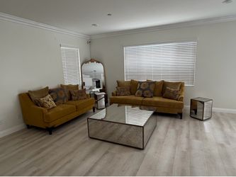 Gold living room set with coffee table and end tables