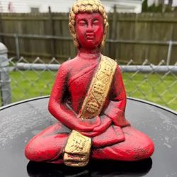 The Red Black And Gold Buddha  Statue