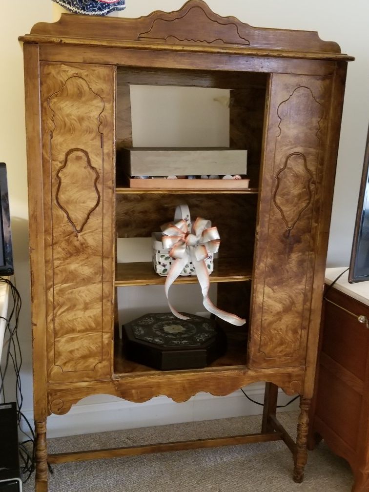Antique armoire DIY project, has front glass door, back is partially open for computer printer and plug cord