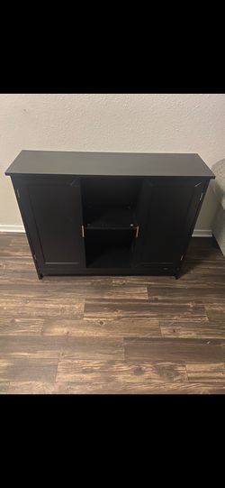 Black small sized accent piece /storage/ tv stand smaller tv