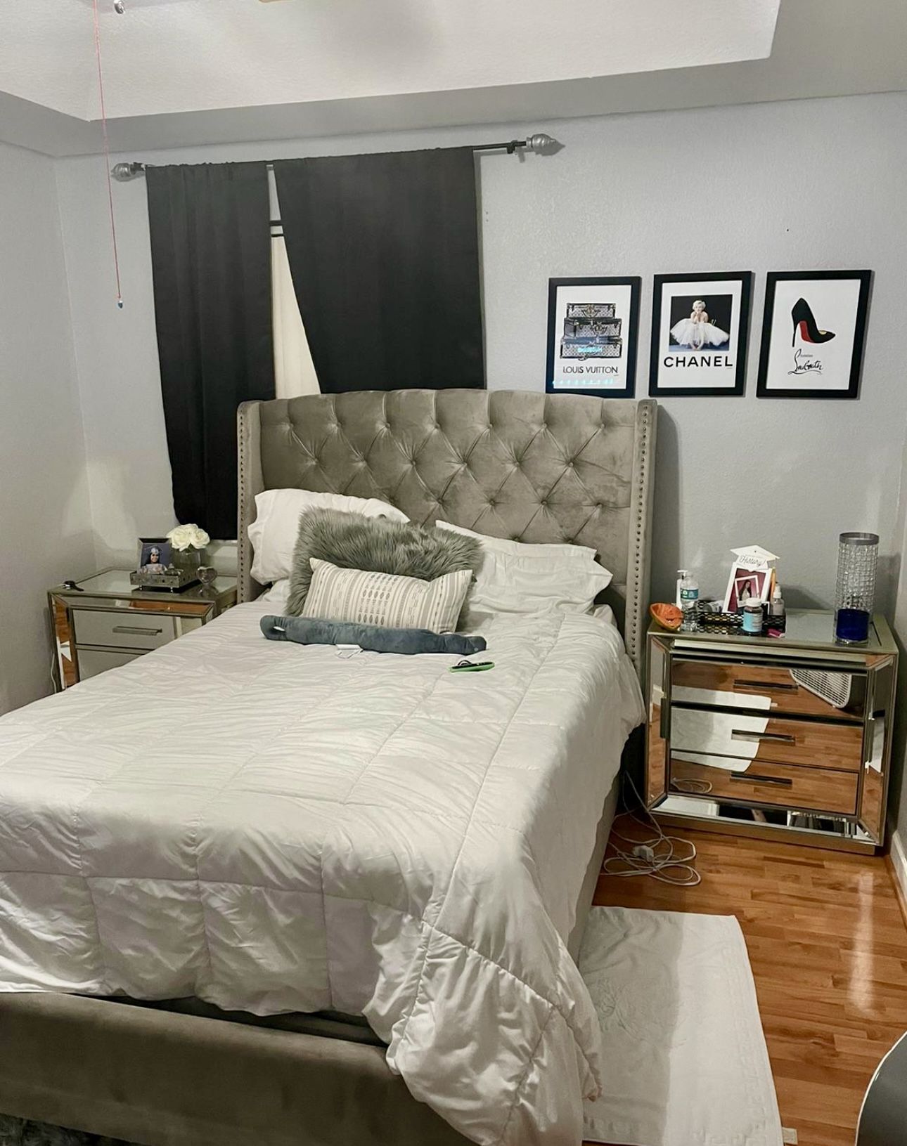 Beautiful gray upholstered bed with two large mirrored nightstands included.