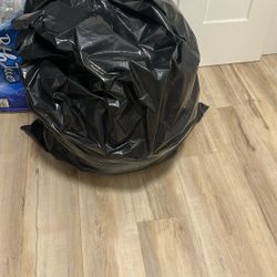 Four White Garbage Bags And One Black Big Bag Of Youth Clothes . Brand Clothes Size Small And Medium $50 For All 