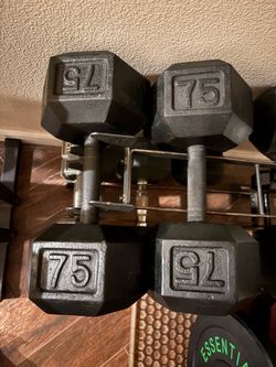 Pair of 75 lb fixed hex cast iron dumbbells