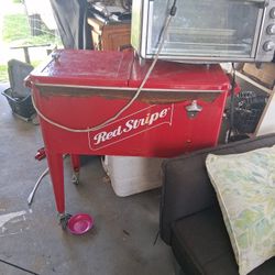 Ice chest in a Black and Decker.\nToaster slash oven