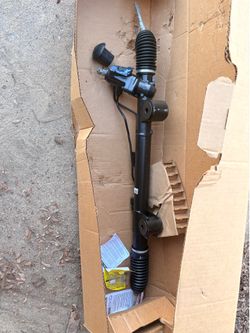 automotive power steering rack and pinion assembly
