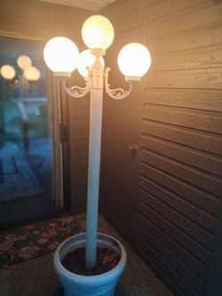 European park style four white globe plug in outdoor white lantern with planter