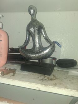 Lil yoga statue