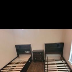 Twin mahogany beds with drawer storage and shelves and dresser. Price is negotiable