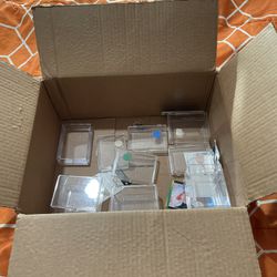 A Box Of Sports Card Cases