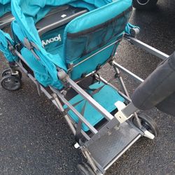 Double Stroller With A Third Seat In The Back