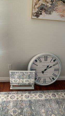 Mirror with a white wall clock
