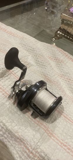 Clean Shimano Torium 20PG fishing reel. Loaded with Spectra fishing line already spooled.
