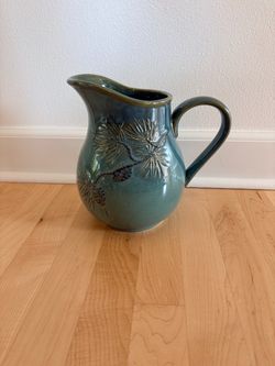 Glazed Blue-Green Pottery Pitcher with Pine Needle/Pinecone Design