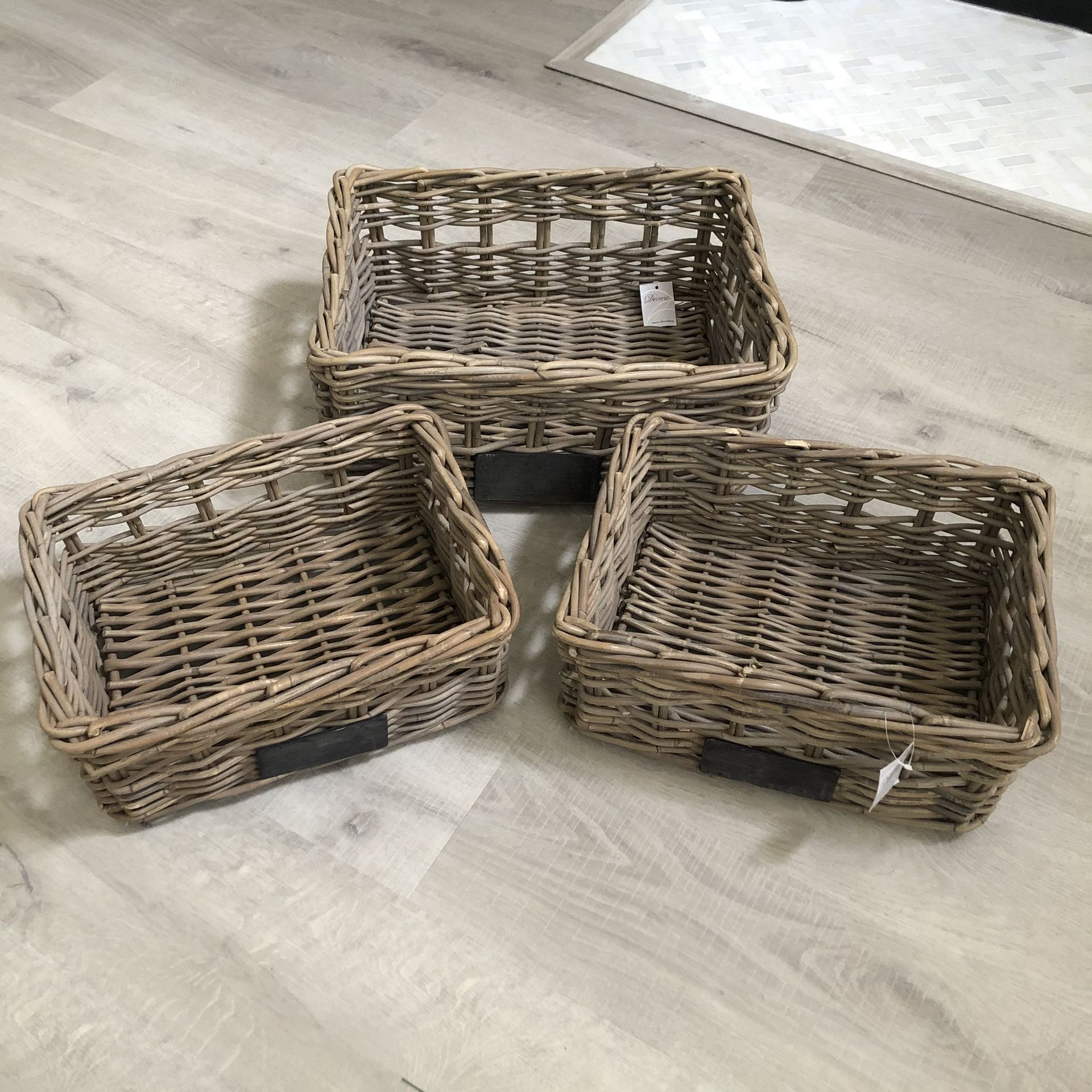 Set of three wooden baskets