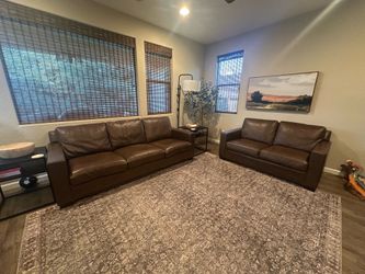 Brown leather sofa and love seat set