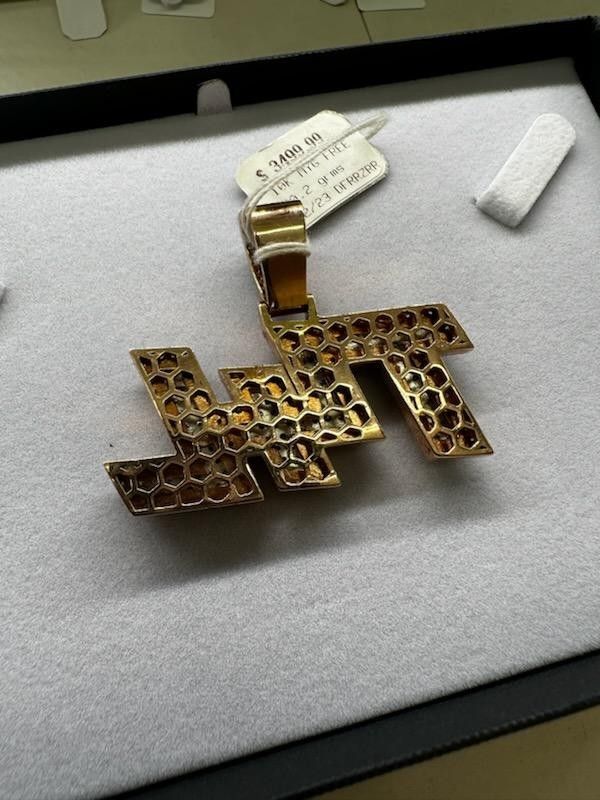 Name pendant 10k gold 30.2 grams $2,124 plus tax/ $2300 flat