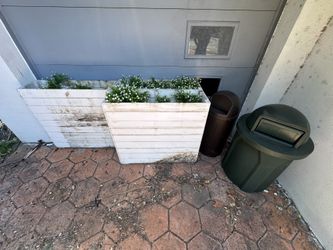 Planters And Rubbermaid Trash Bins