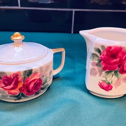 Vintage European porcelain lidded sugar bowl and creamer. Hand painted
