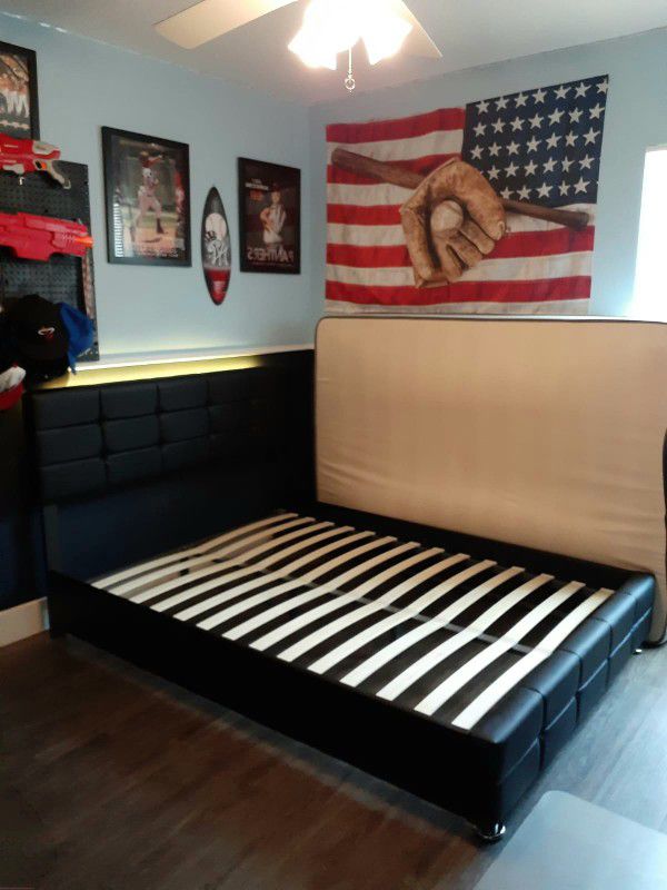NEW FULL UPHOLSTERED BED FRAME. Mattress sold separately