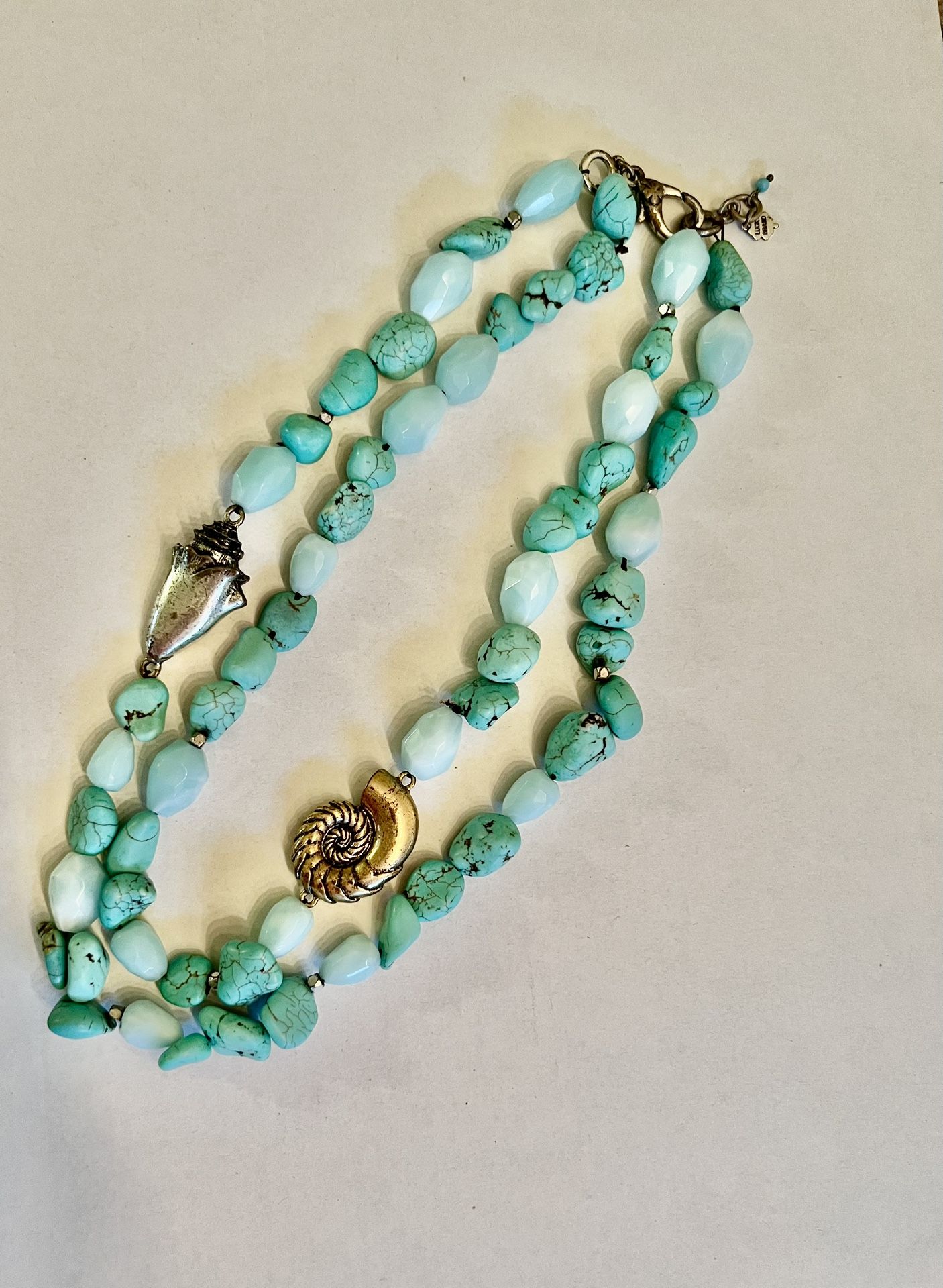 Lucky brand double strand turquoise necklace with two metal shells 19 inches in length