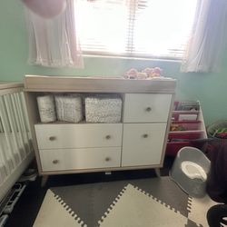 Infant changing station with drawers