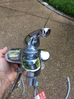 Used stainless steel kitchen faucet in good shape.