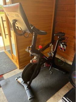 Peloton Bike with mat and shoes