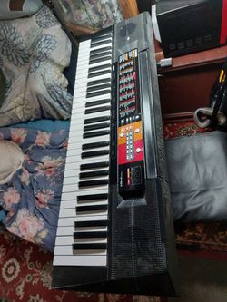 Yamaha Synthesizer . if with stand add $25